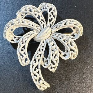 27- Crown Trifari White Filigree Enamel Bow Brooch